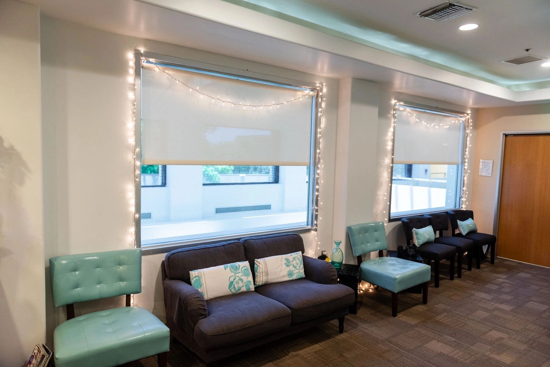 Comfortable waiting room with string lights